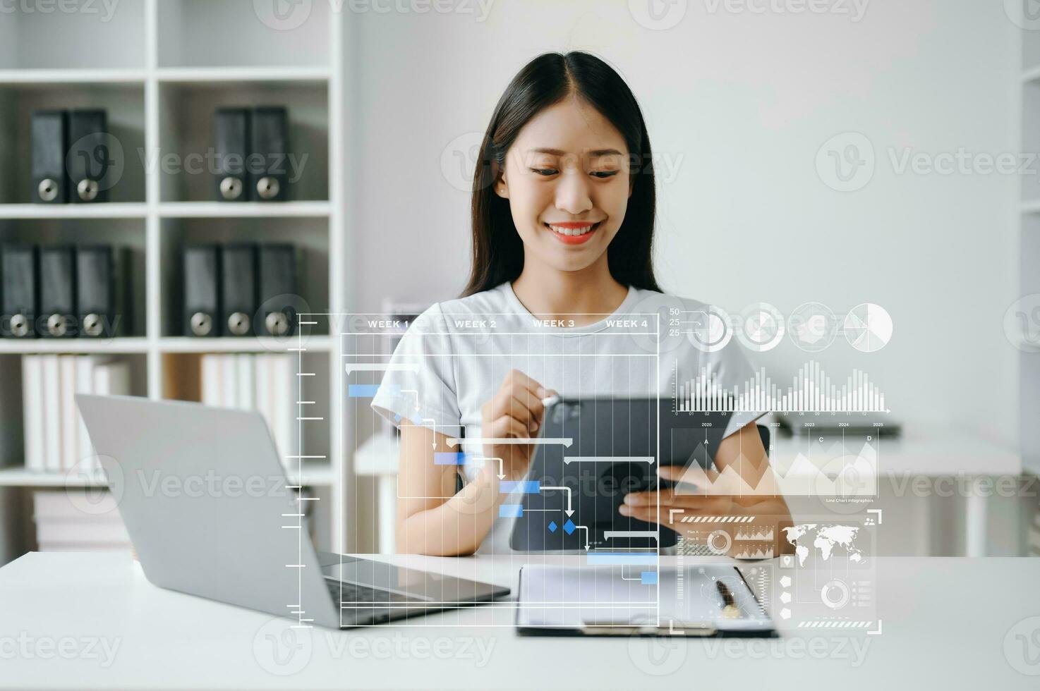 Asian Businesswoman hand Project manager working and update tasks and Gantt chart scheduling virtual diagram.with smart phone, tablet and laptop in office. photo