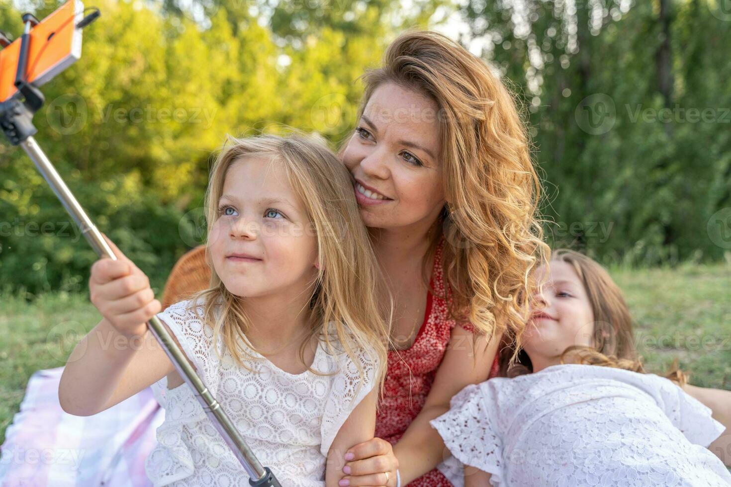 Sisters spending time in a tent on camping. Children using tablet playing games  online during summer vacation - a Royalty Free Stock Photo from Photocase