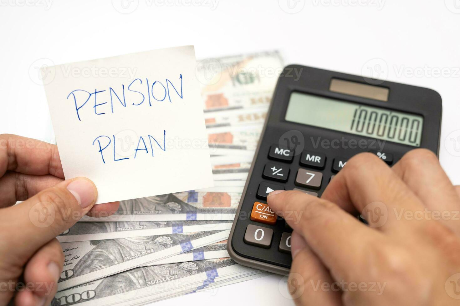 Paper note with phrase Pension Plan, dollar banknotes, calculator. Retirement concept. Retirement saving and pension planning. photo