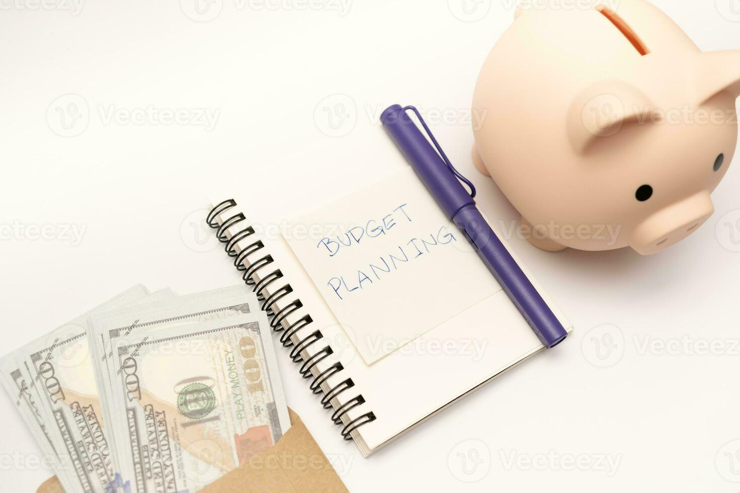 Money budget planning. Piggy bank with calculator and notebooks on white background, financial goal concept. photo