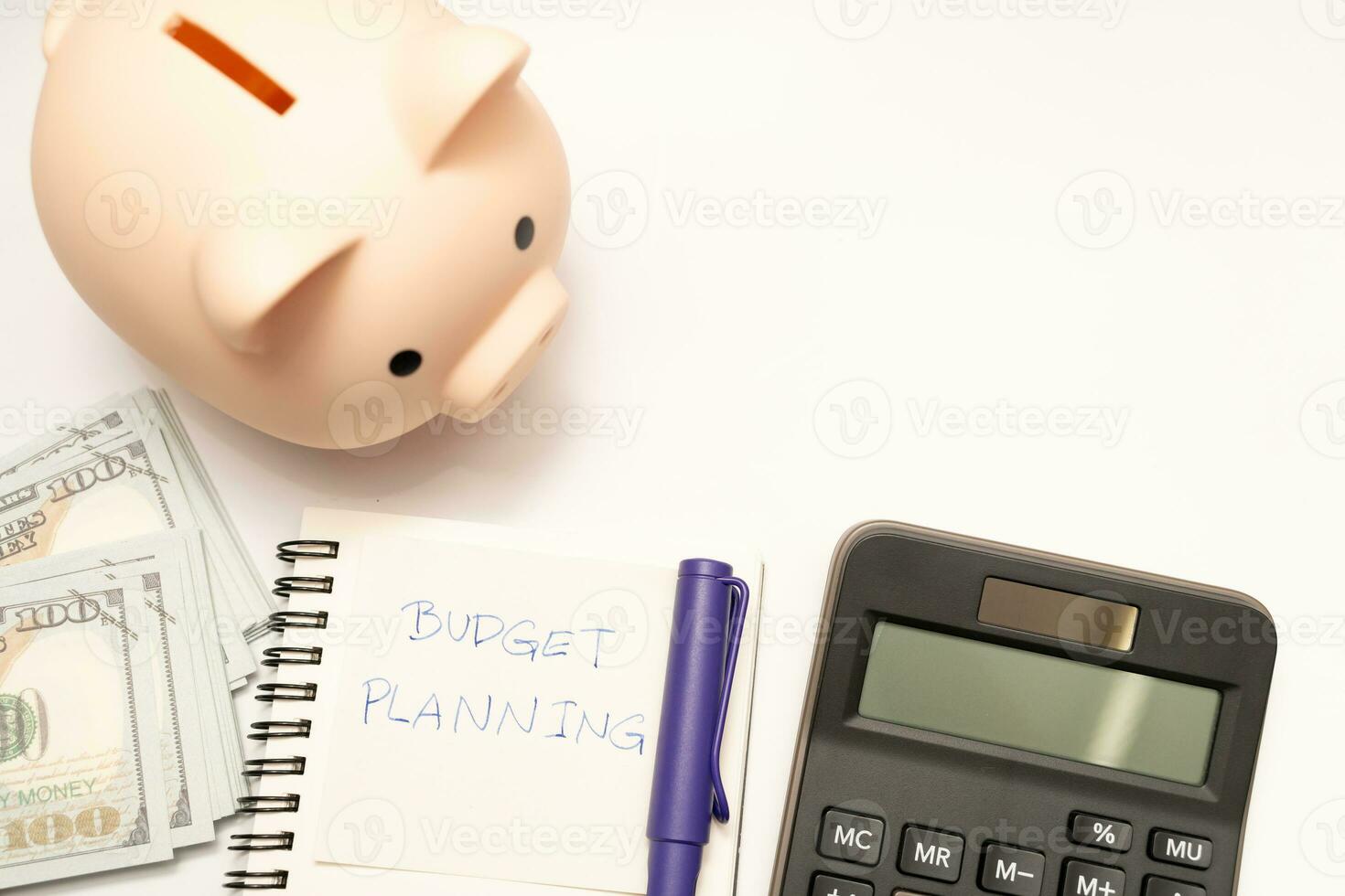 Money budget planning. Piggy bank with calculator and notebooks on white background, financial goal concept. photo