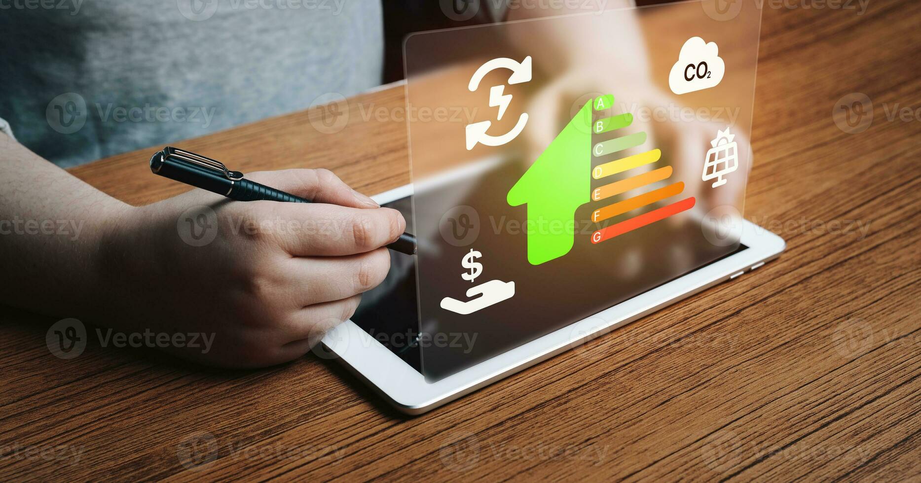 Woman use digital tablet for rating energy efficiency and eco home renovation. Low consumption ecological house, sustainable development concept. photo
