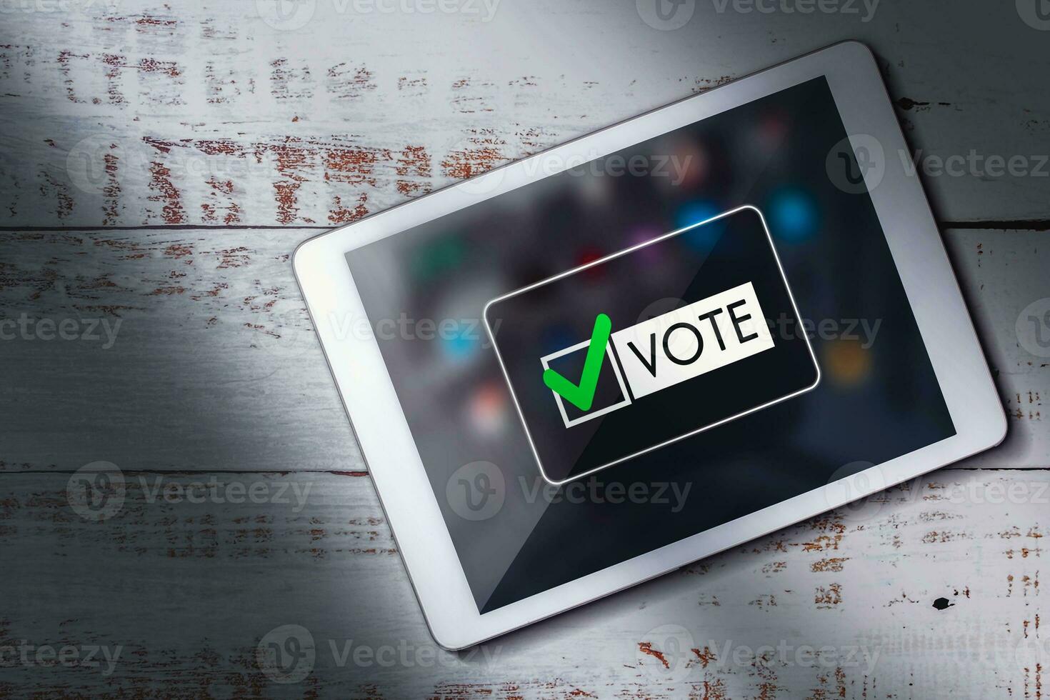 Top view of digital tablet on wood desk with online voting on screen. Political concept. Electronic internet voting. Customer feedback. photo