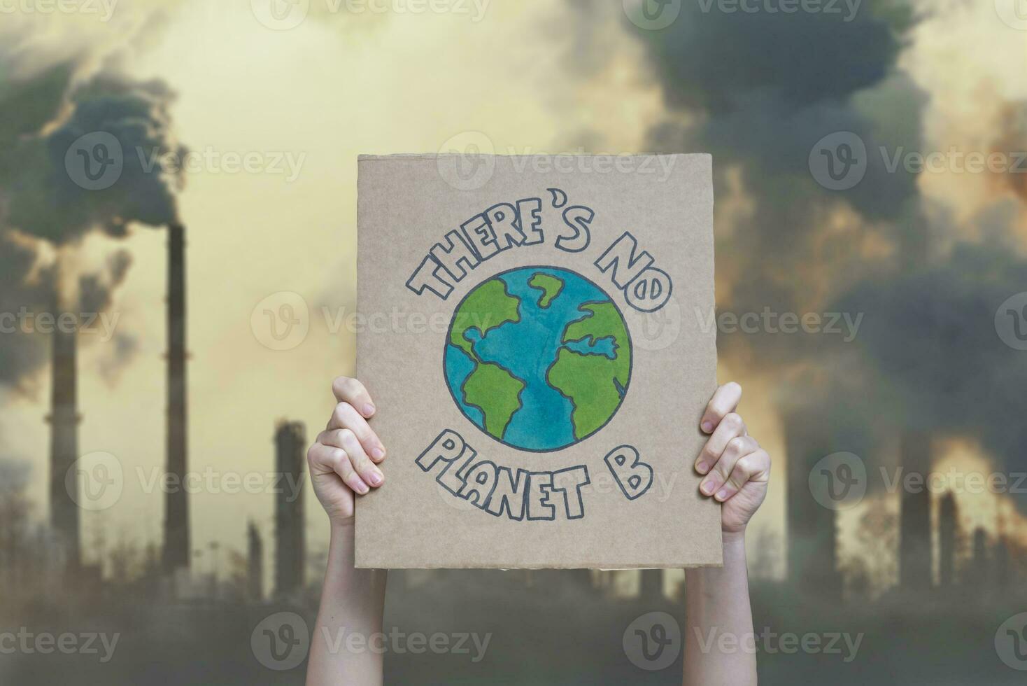 Climate change manifestation poster on an industrial fossil fuel burning background. There is no planet b photo