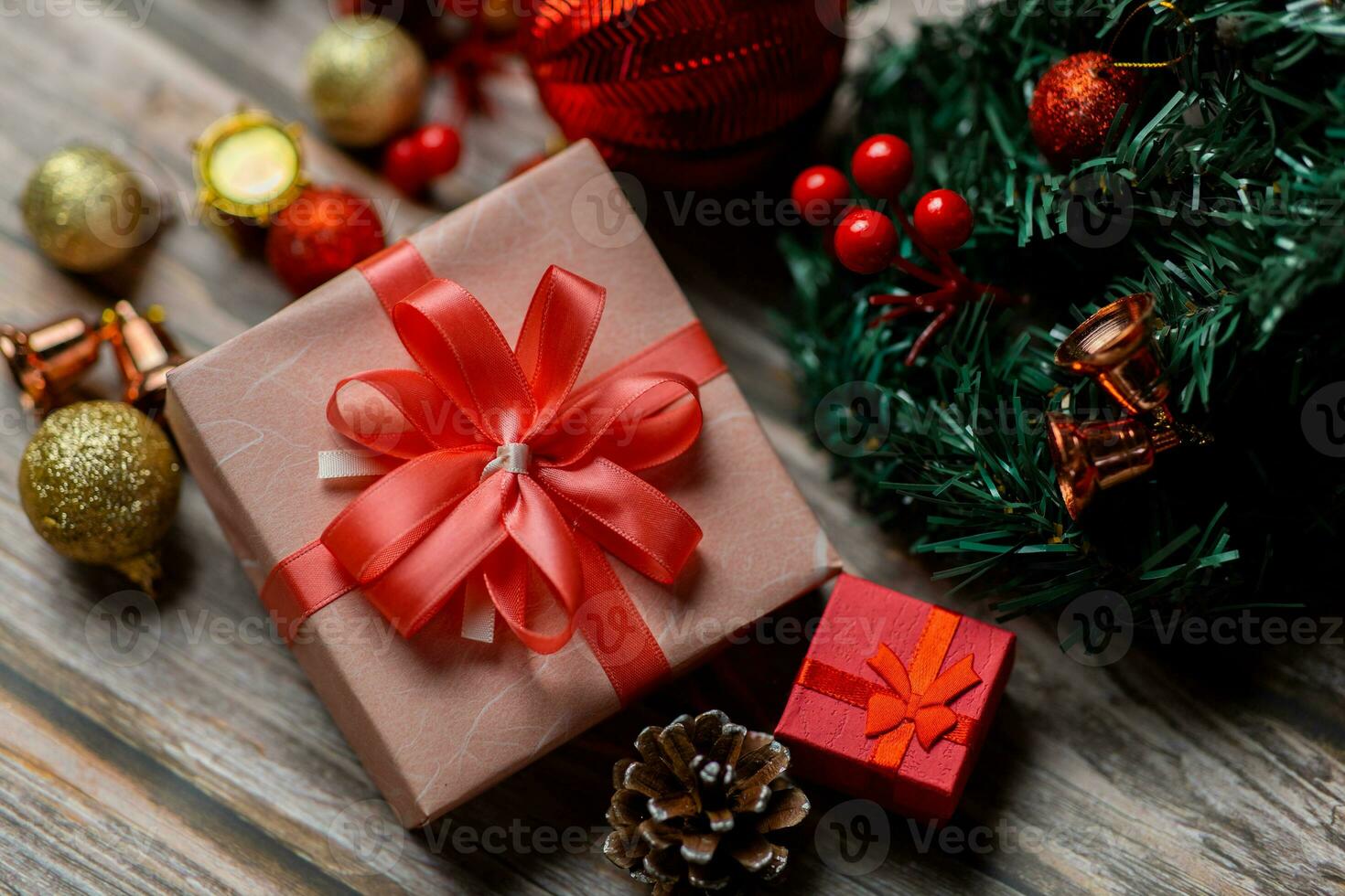 Closeup of pink gift box and Christmas composition on a wood background. Layout Christmas background concept. photo