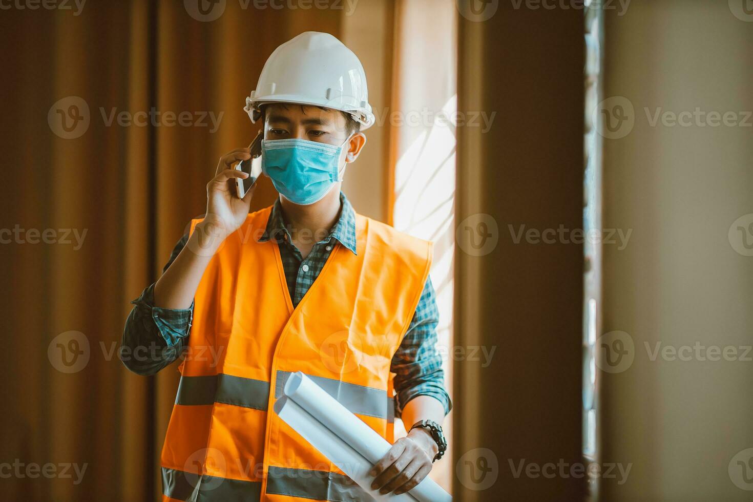 Portrait of industrial engineer man wears protective mask in office for prevention COVID-19 virus to stop spreading. photo