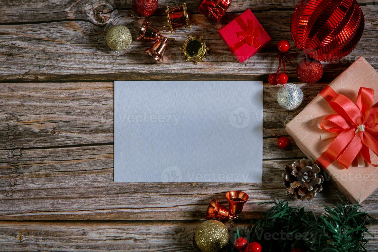 Christmas composition on a wood background and a blank red card for writing the text. Layout Christmas background concept photo