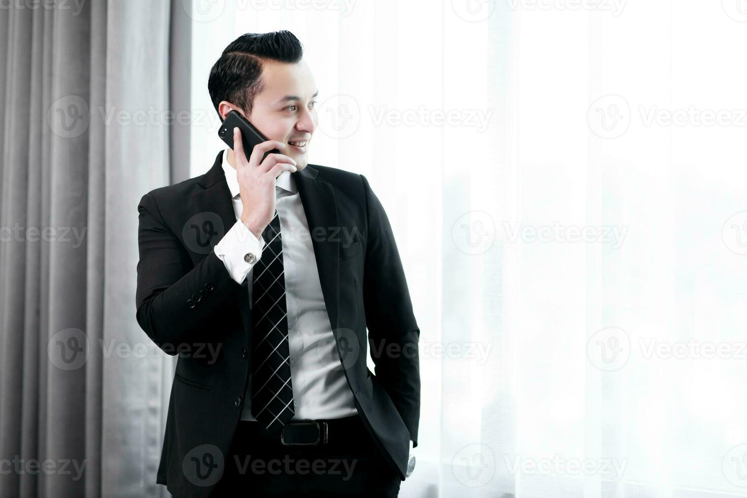 Businessman using smartphones in the company for contact work project. Concept of business people using technology. photo