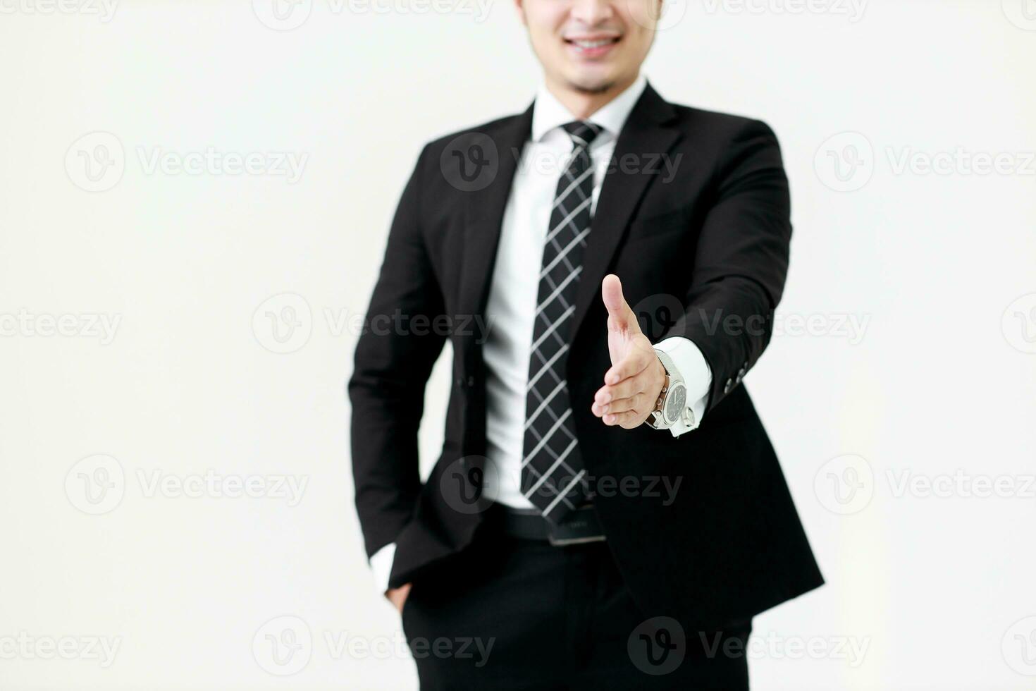 Business Asian man offering handshake ready to a deal at copy space isolated on white background, Partner shaking hands concept. photo