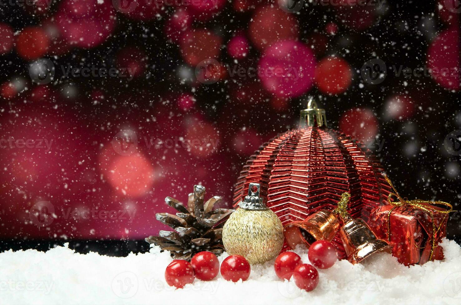 Beautiful christmas decoration on snow with red bokeh background photo