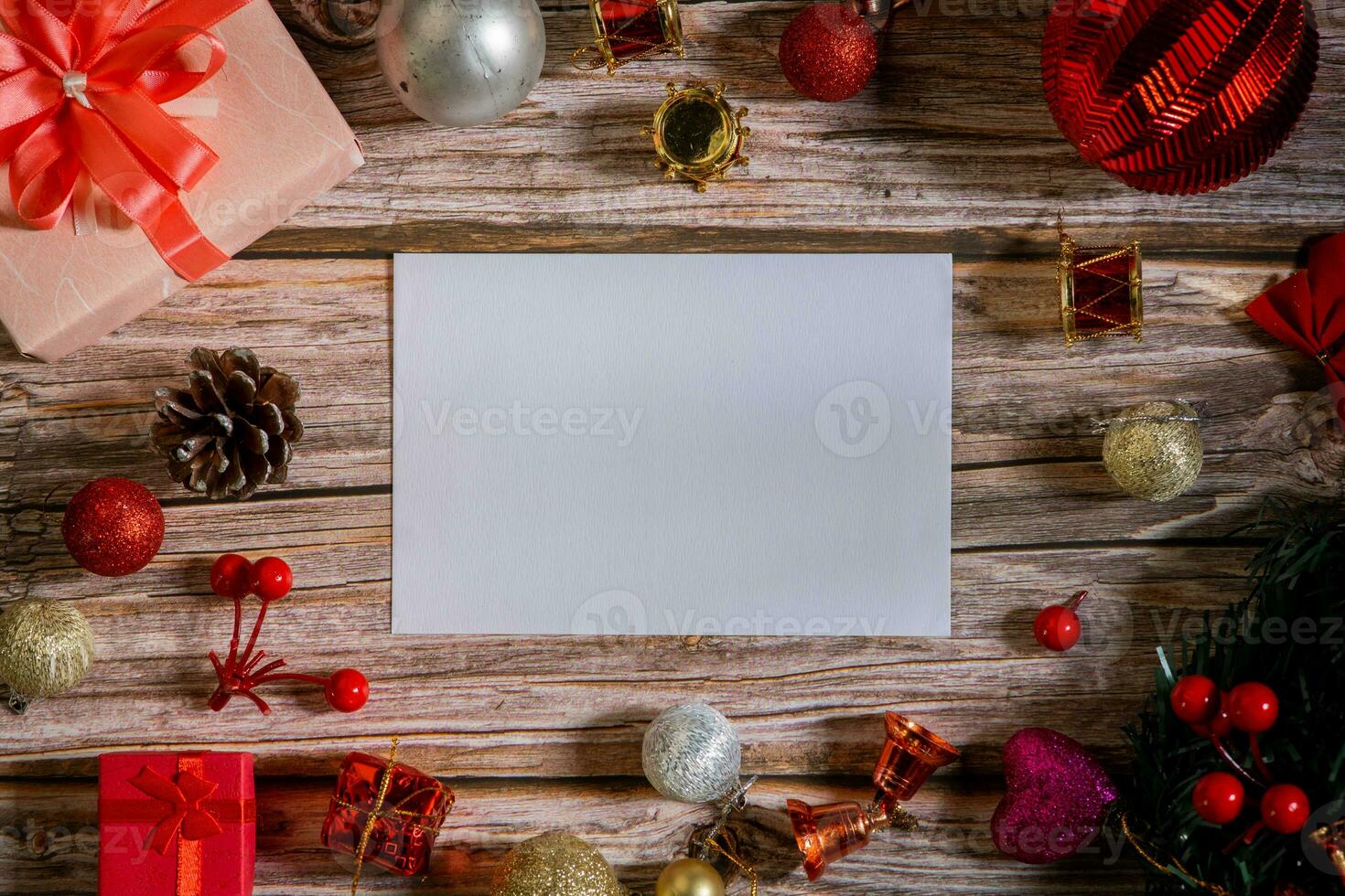 Christmas composition on a wood background and a blank red card for writing the text. Layout Christmas background concept photo