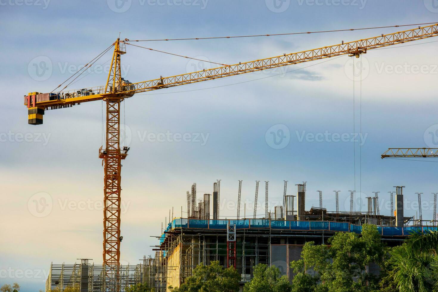 cranes working on a building construction site photo