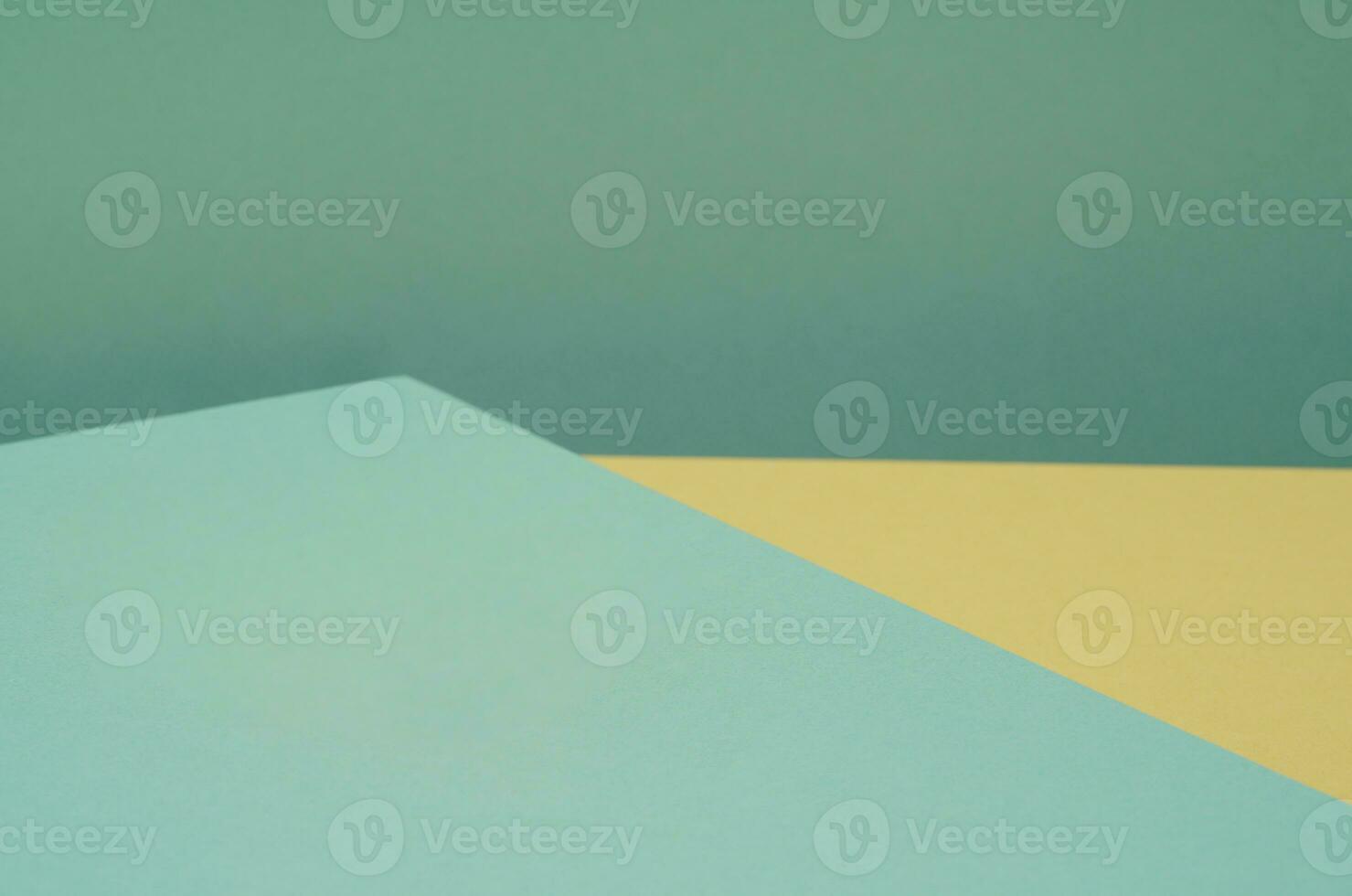 Colorful background from green and yellow paper with shadow. Abstract geometric photo