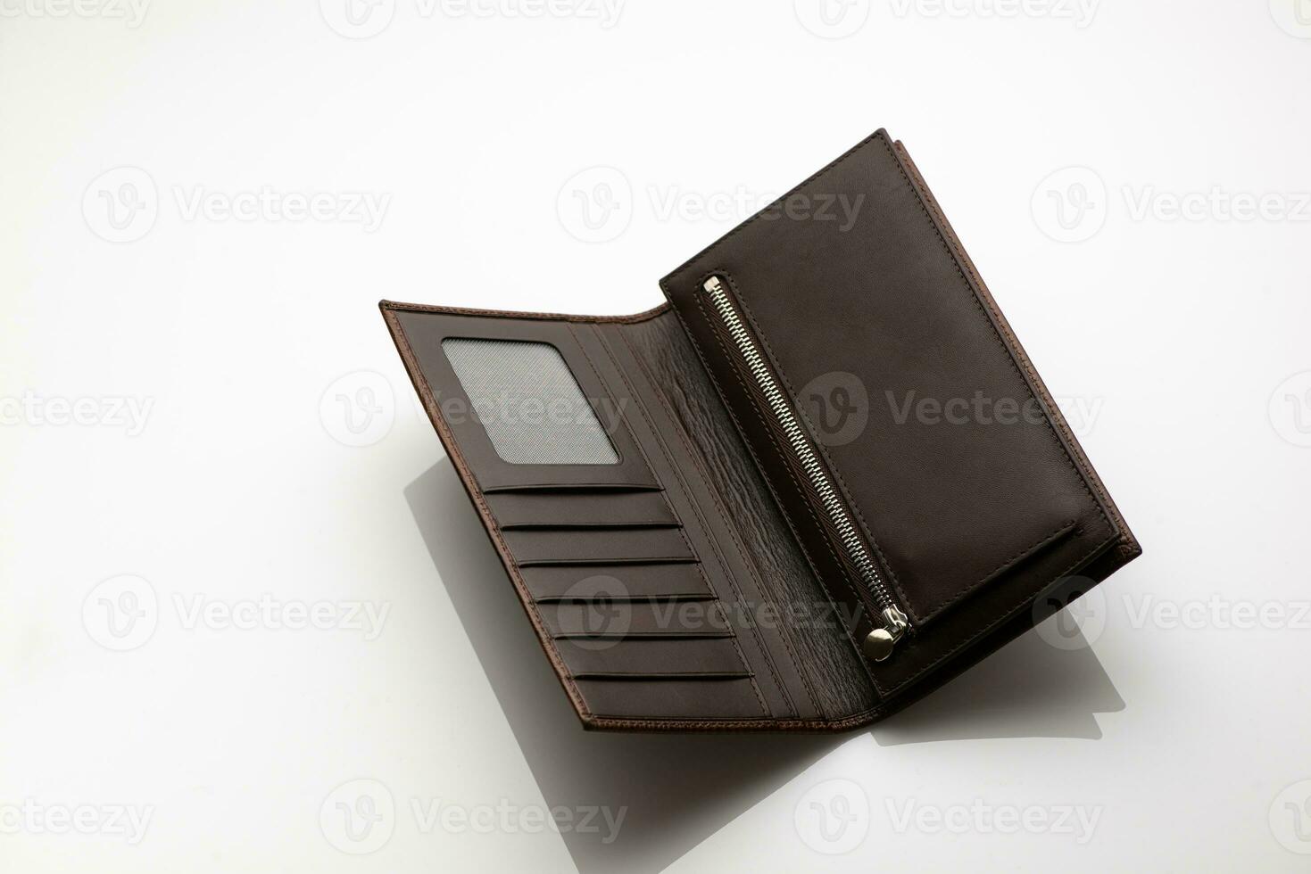 Close-up shot of a fashionable leather men's wallet on a white background with reflection photo