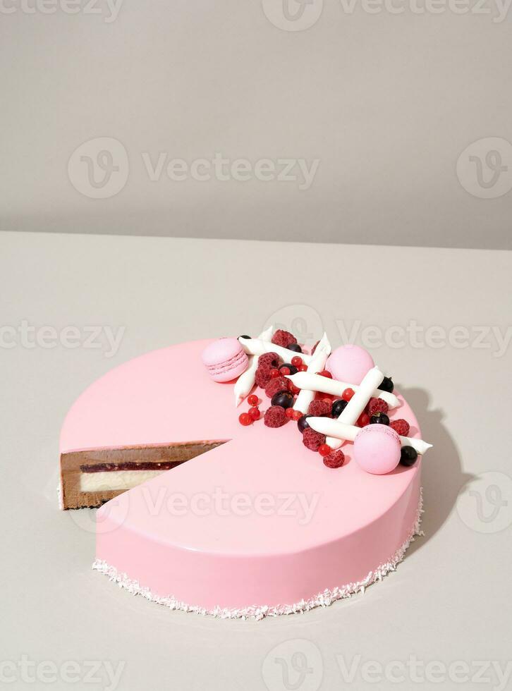 A close-up shot of a delectable cake featuring a raspberry and white chocolate topping photo