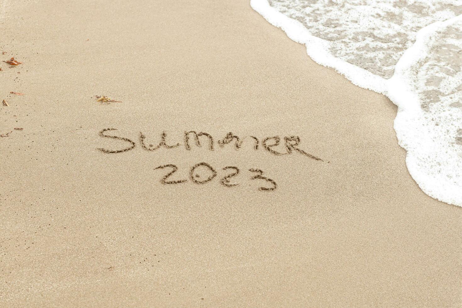 Summer 2023 written on the sand photo