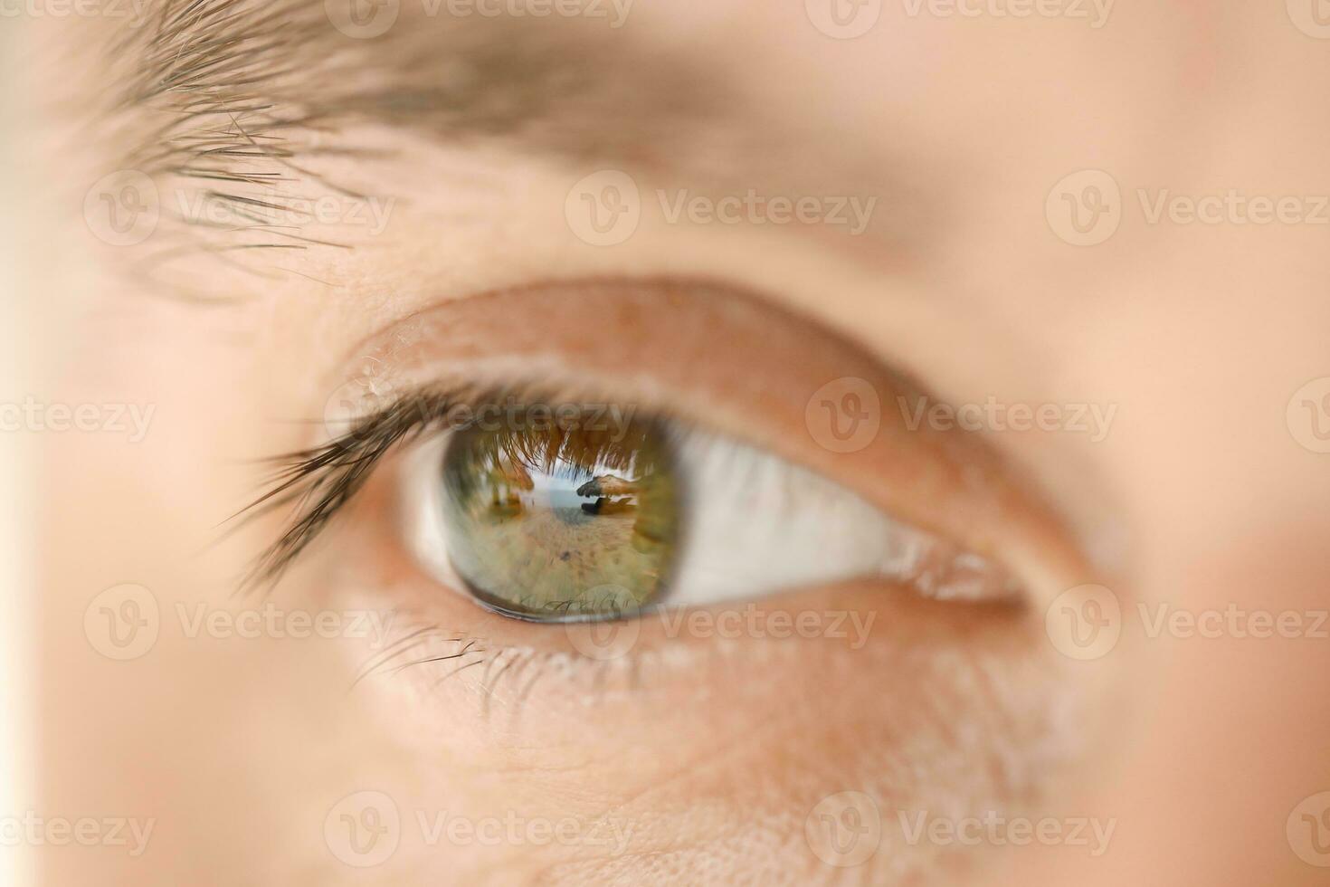 Close-up of a male eye that reflects beach photo