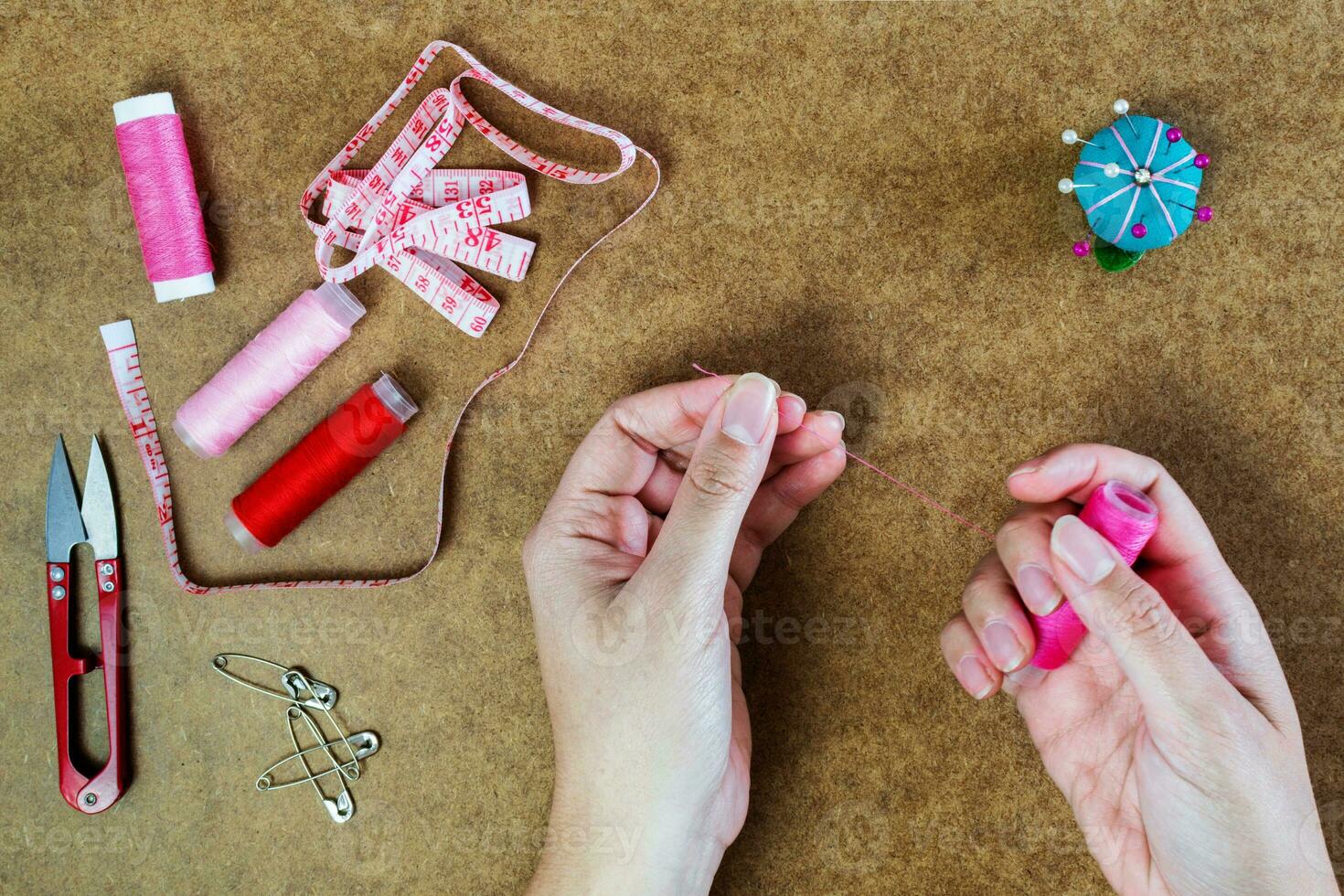 sewing set, female hands, Top view photo
