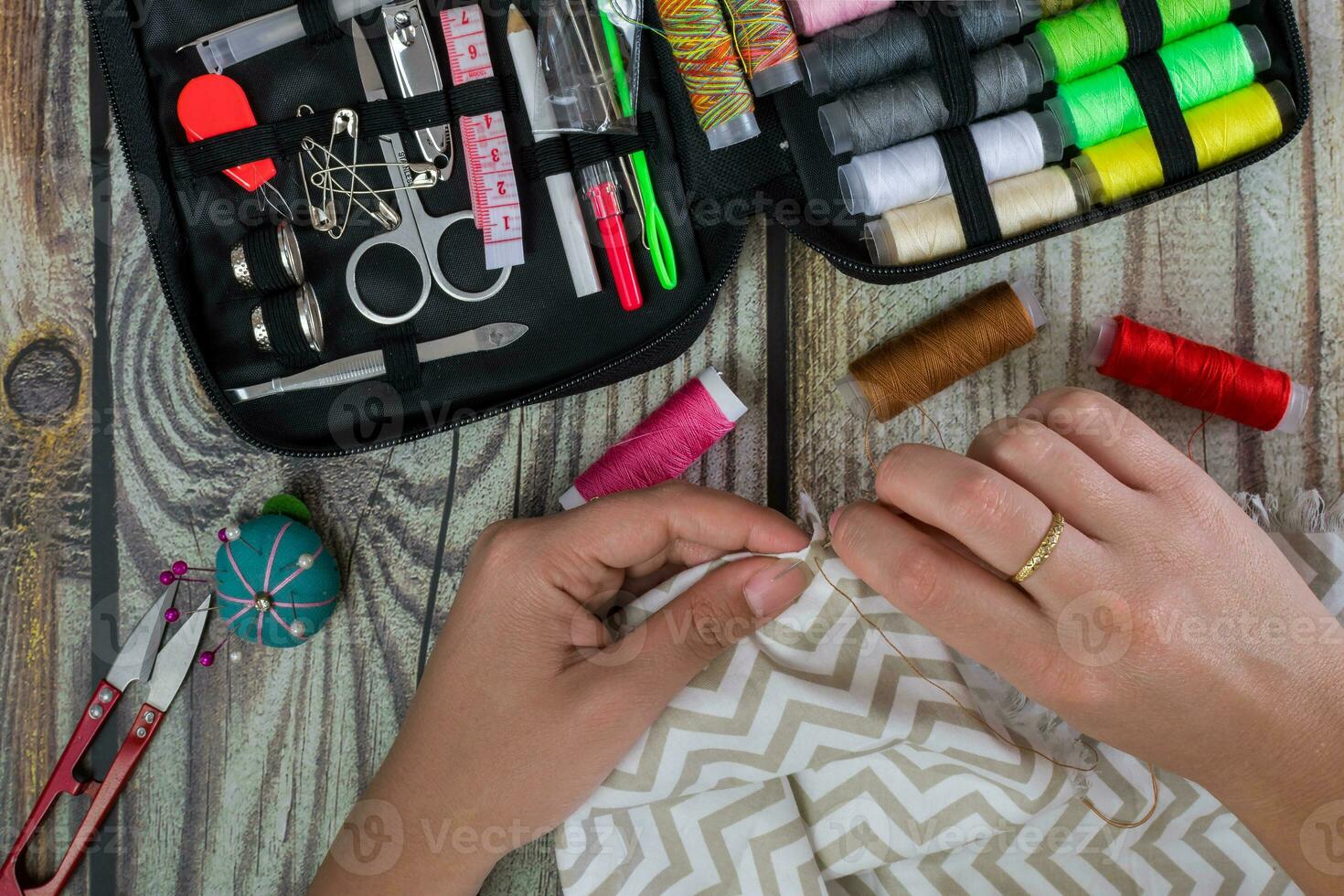 sewing set, female hands, top view photo