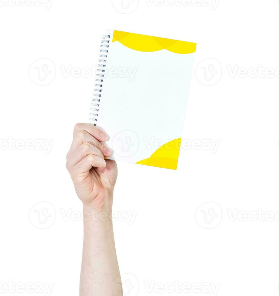 Man's arm raised holding a office supplies notebook. Isolate on white background. photo