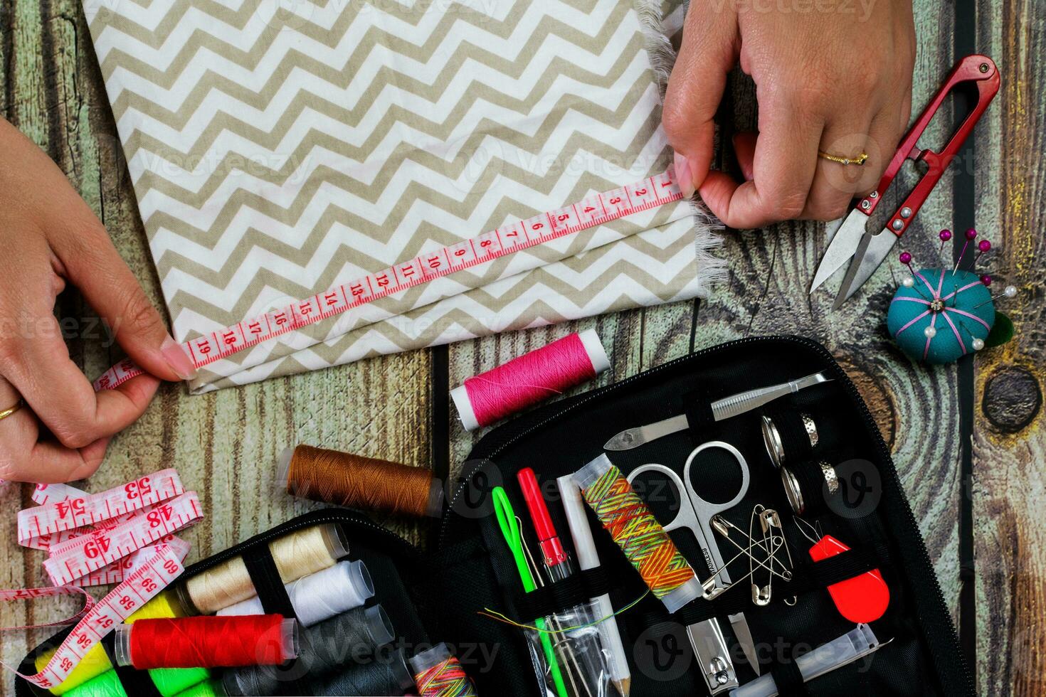 sewing set, female hands. Top view photo
