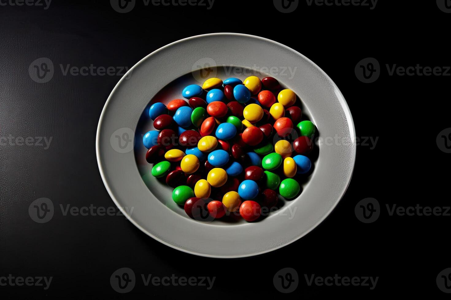 marvelous colorful Chocolates on a plate, black background, illustration, photo
