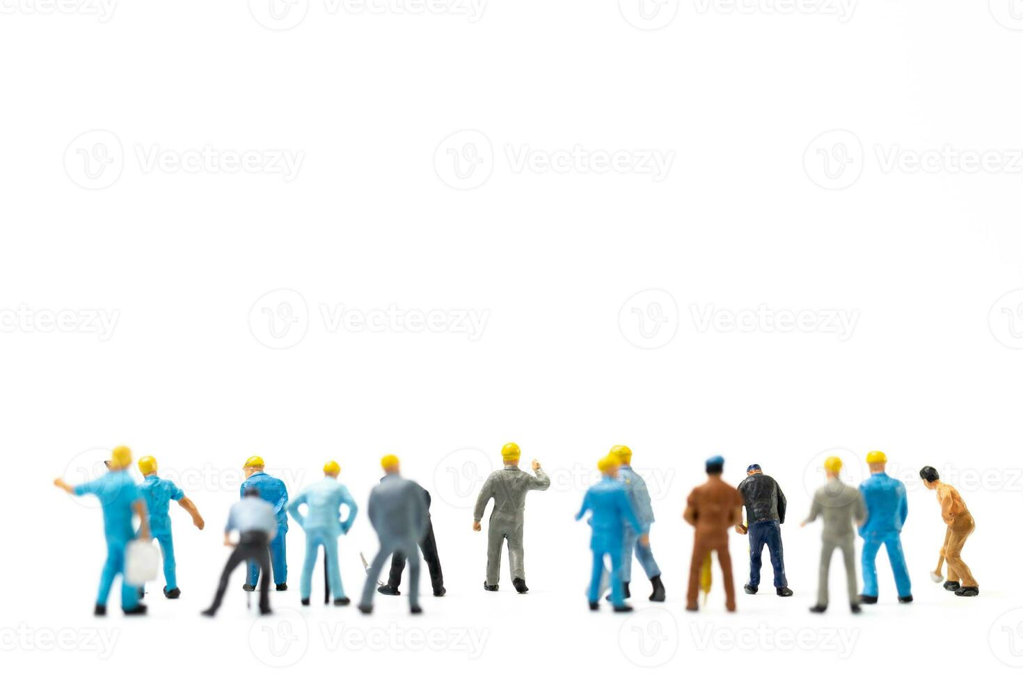 Miniature people , Worker team standing on white background, Labour day concept photo