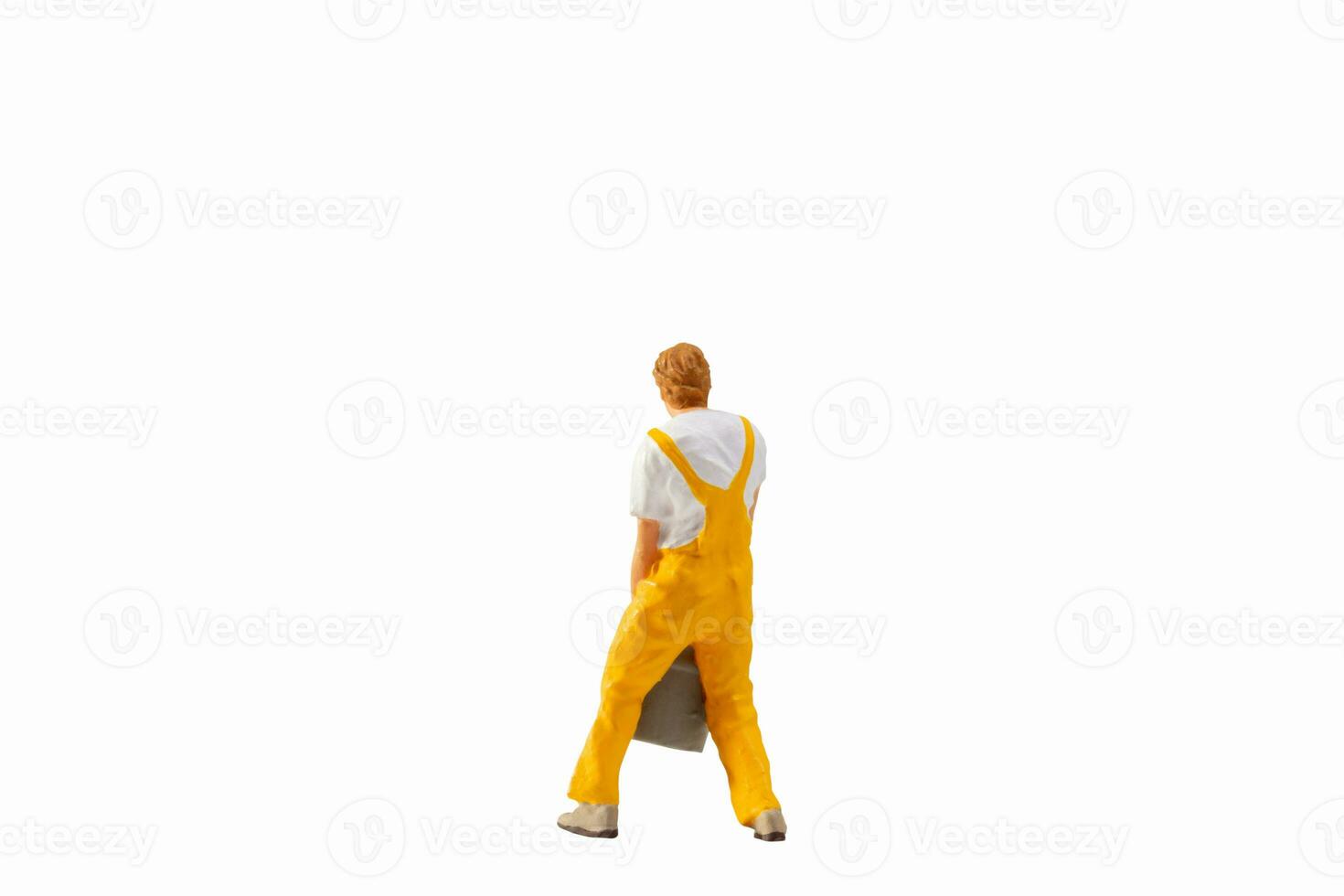 Miniature people, Painter holding paint bucket on white background with clipping path photo