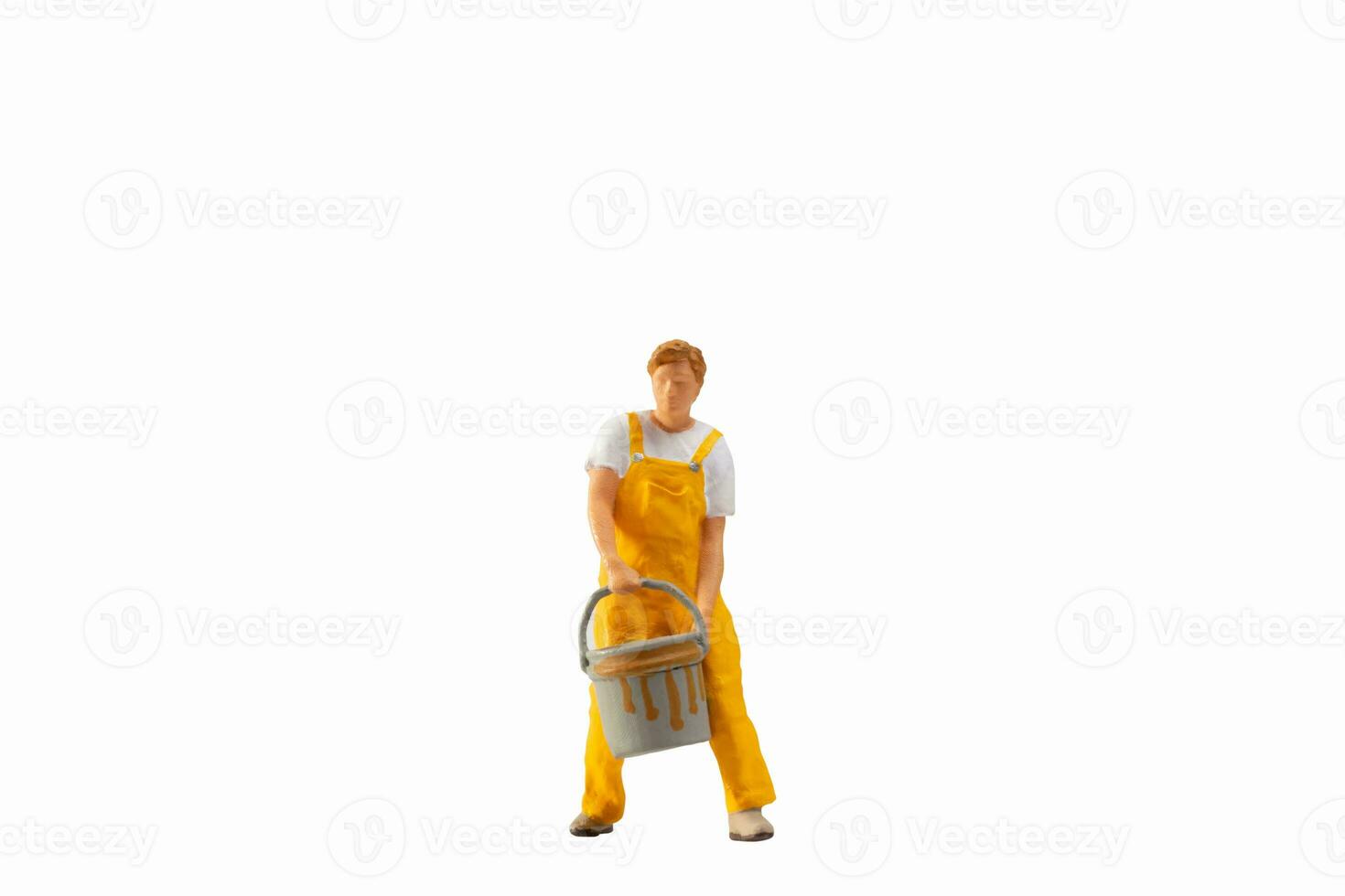 Miniature people, Painter holding paint bucket on white background with clipping path photo