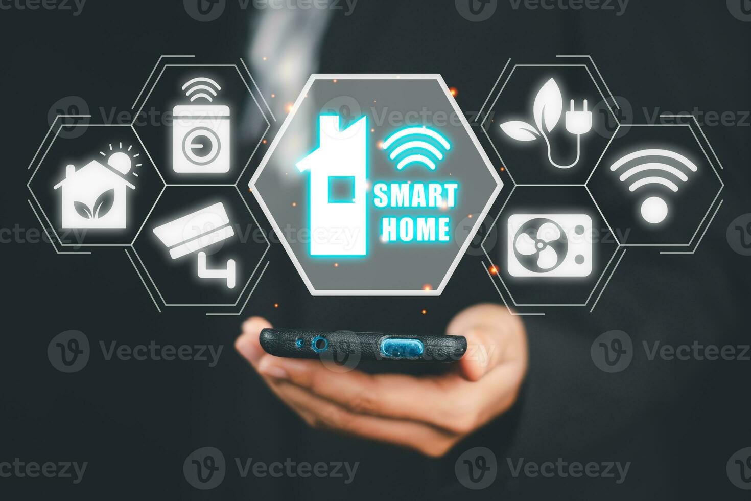 Smart home automation control system, Man hand using smart phone with smart home control icon on VR screen, Innovation technology internet network concept. photo
