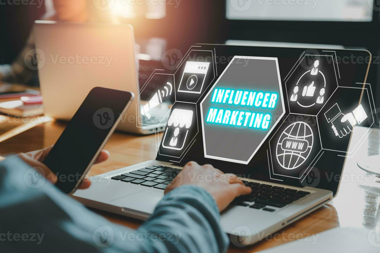 Influencer marketing concept, Person working on laptop computer with Influencer marketing icon on virtual screen. photo