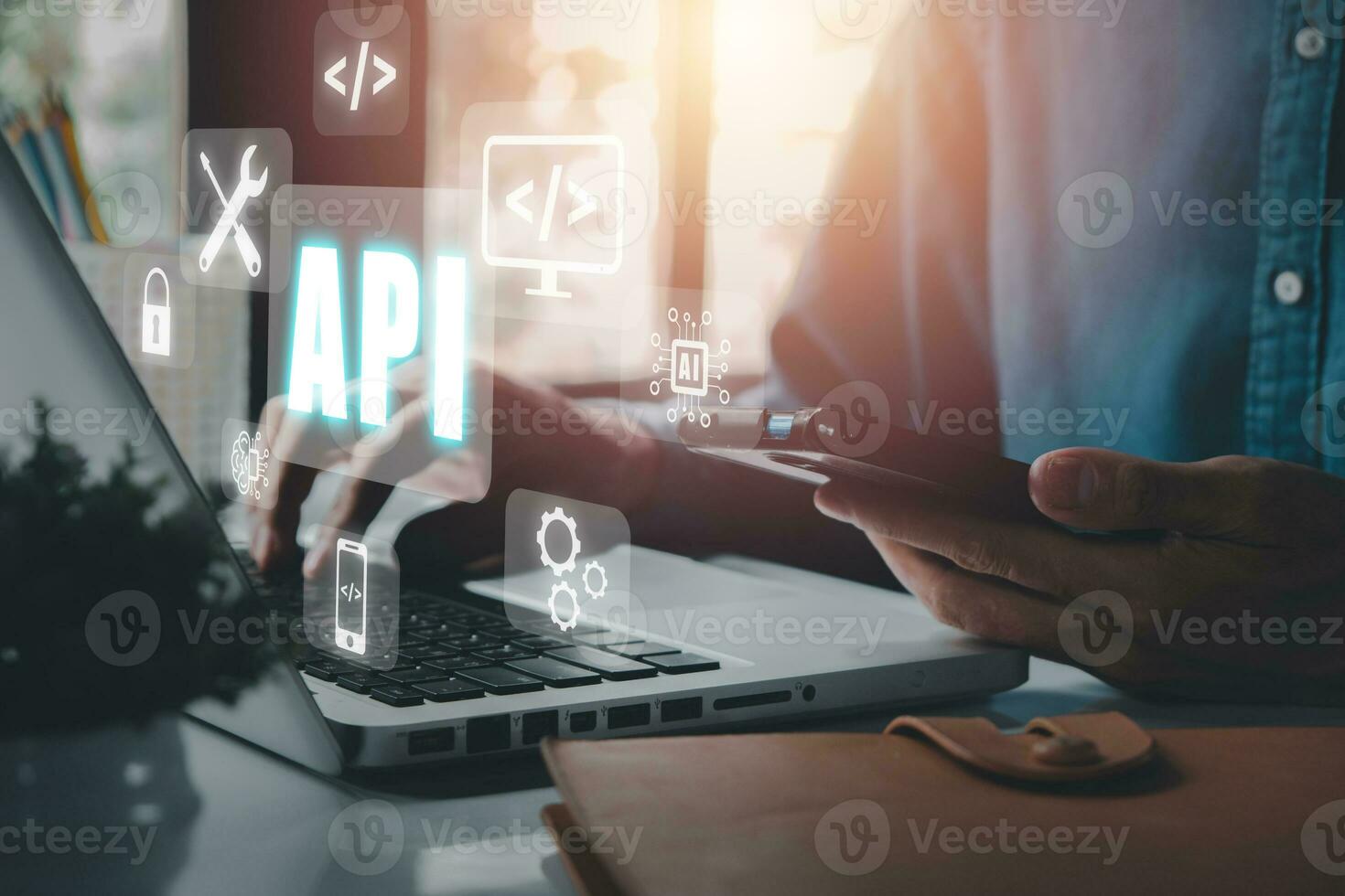 API - Application Programming Interface, Woman using laptop computer with VR screen API icon on office desk, Software development tool, modern technology, internet and networking concept. photo