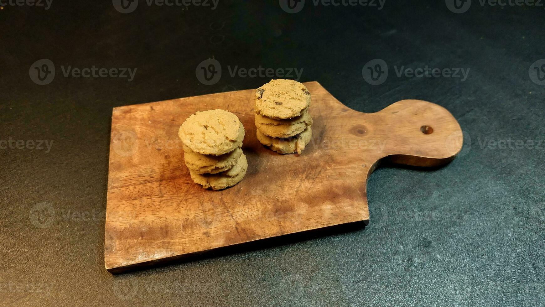 Chocolate chip cookies on a black background. photo