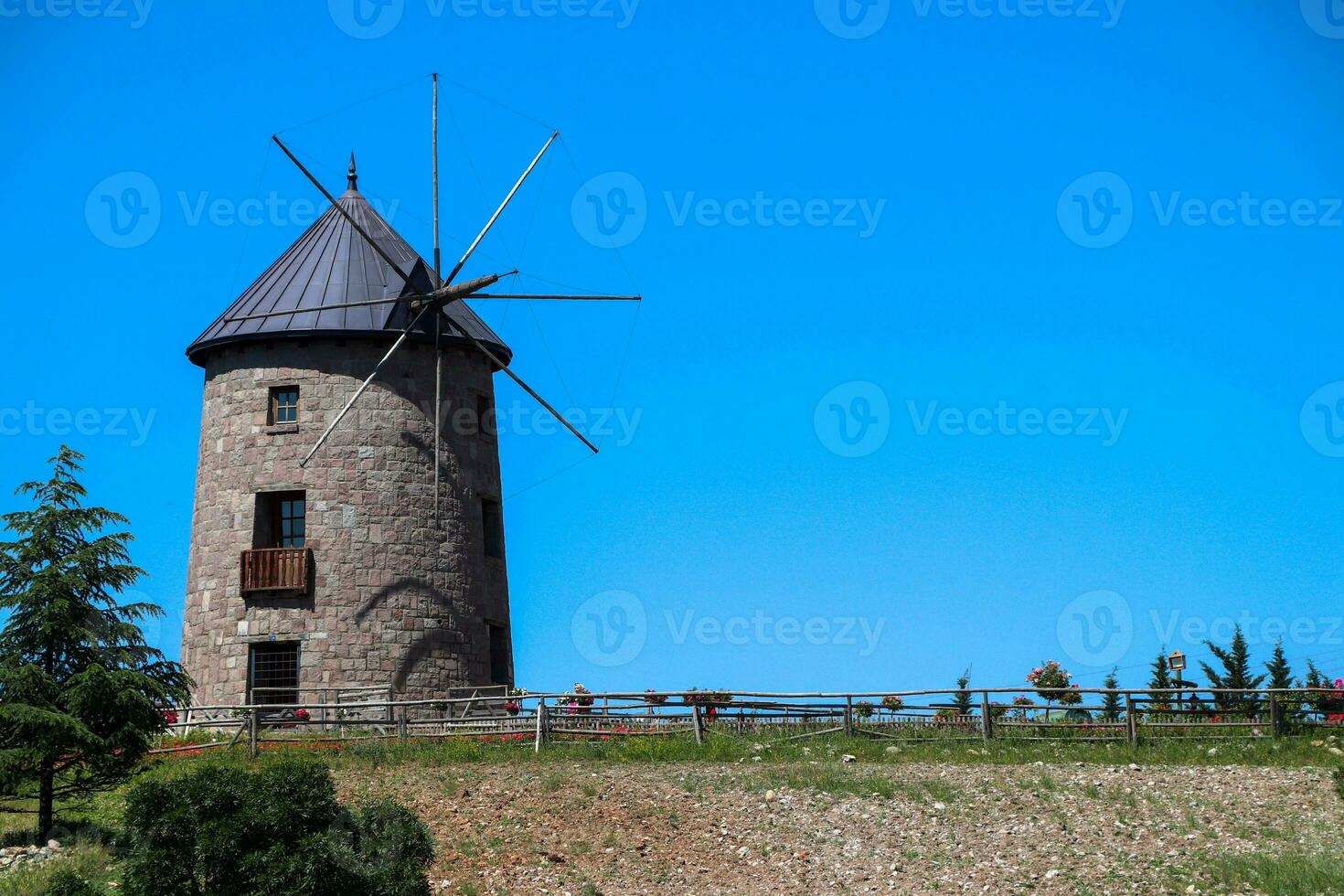 Windmill and blue sky. Photo of windmill with harvests