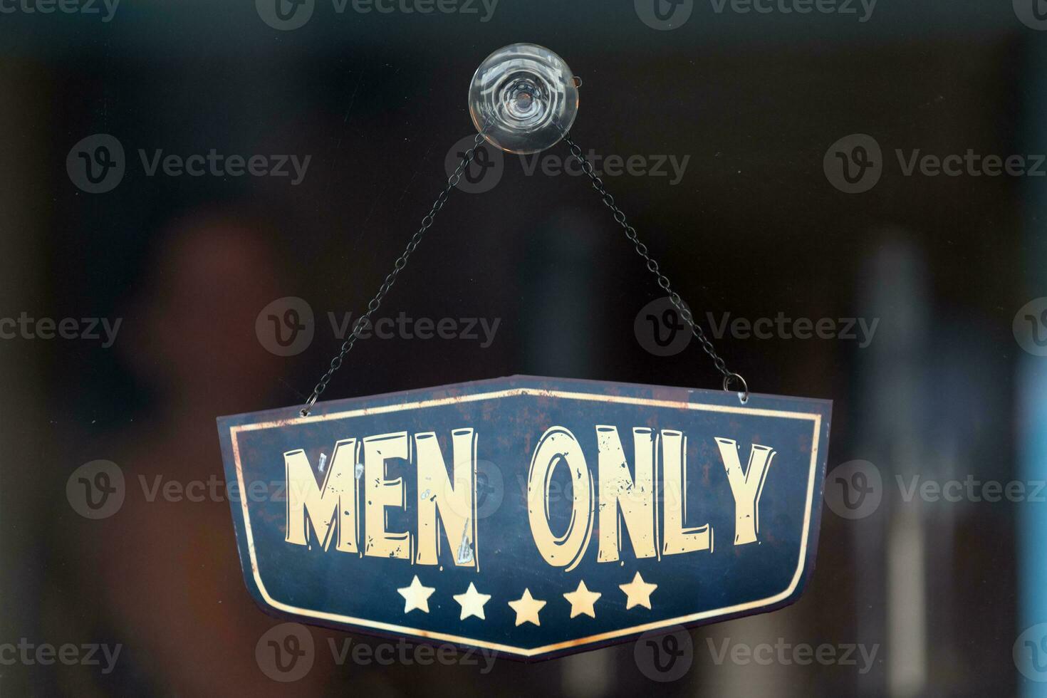 Men only sign in the window of a shop photo