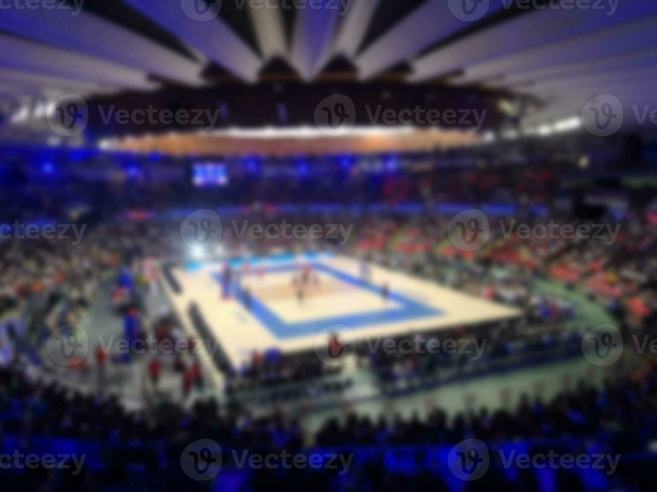 burred for background indoor stadium is playing a women's volleyball photo