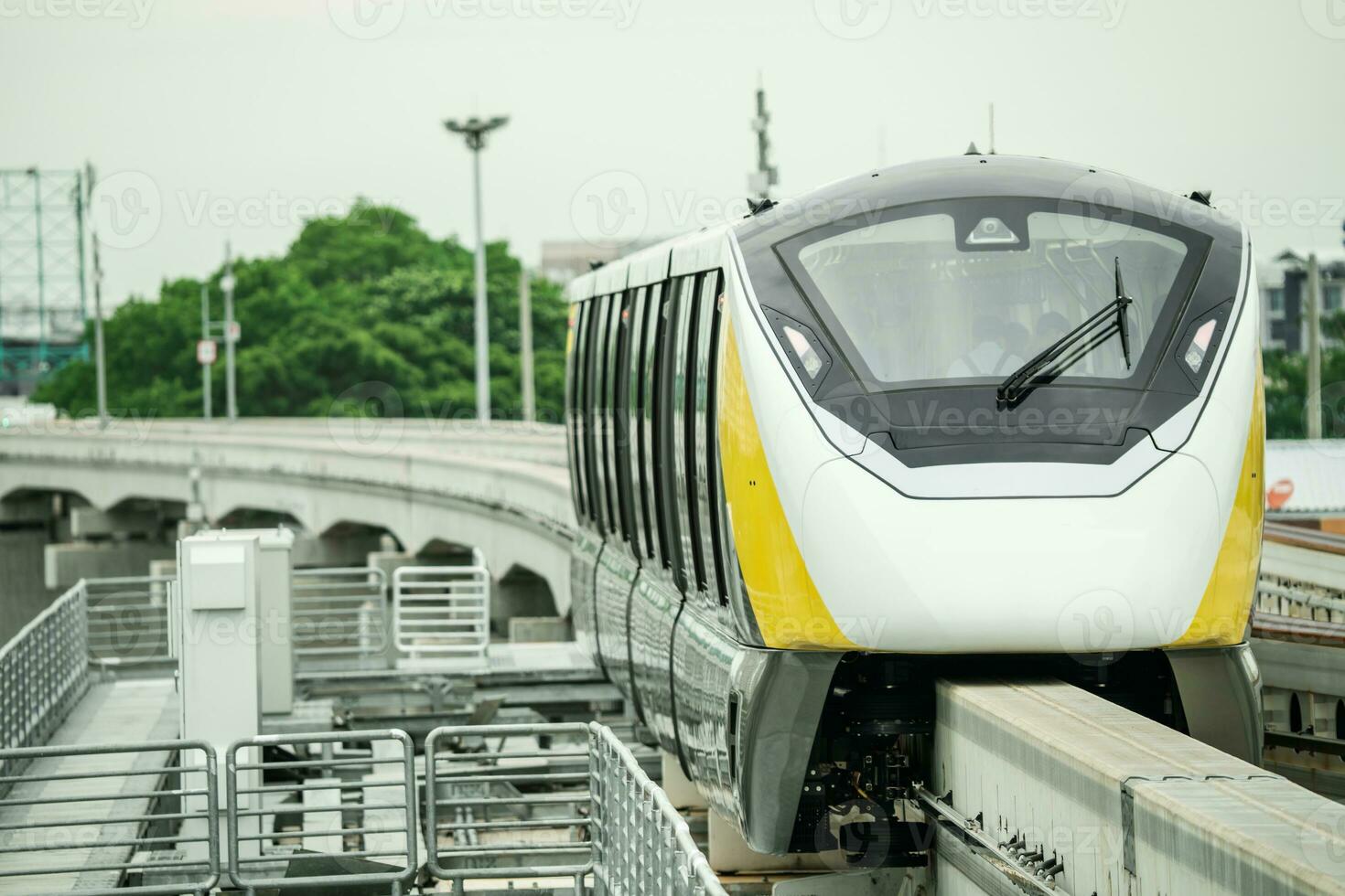 Elevated monorail train on rail. Public transit monorail. Modern mass transit. Electric vehicles. Rail transportation. Urban transport. Commuter train. Monorail technology. Rapid transit in the city. photo