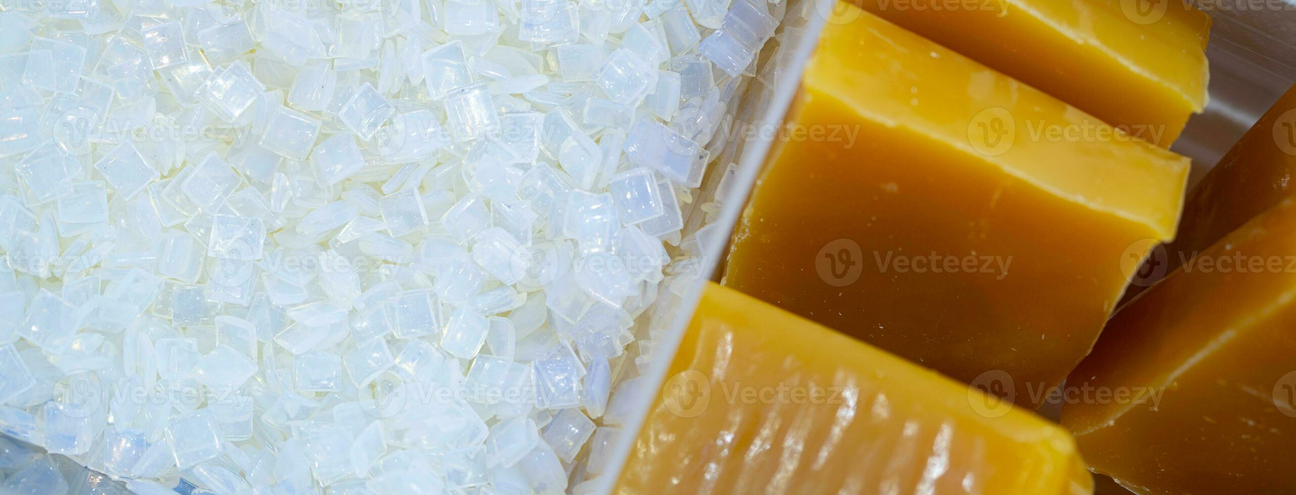 Hot melt adhesive in food labeling and packaging. Thermoplastic polymers. Non toxic hot melt glue block and hot melt adhesive pastilles or pellets. Chemical business industry. Packaging solutions. photo