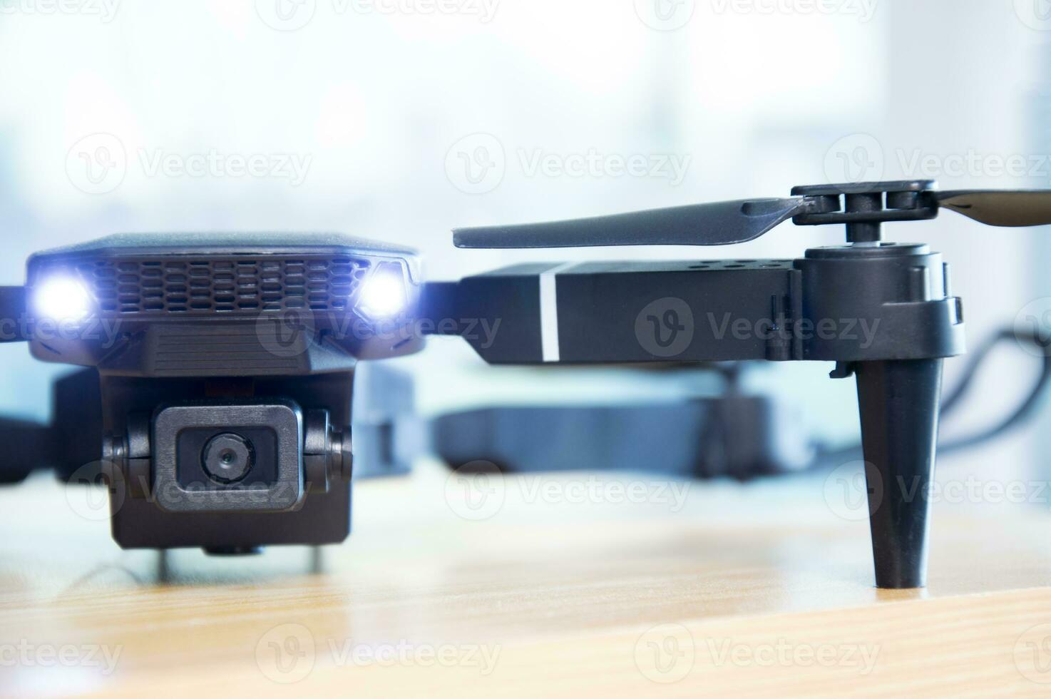 Close-up front view of a black drone. photo