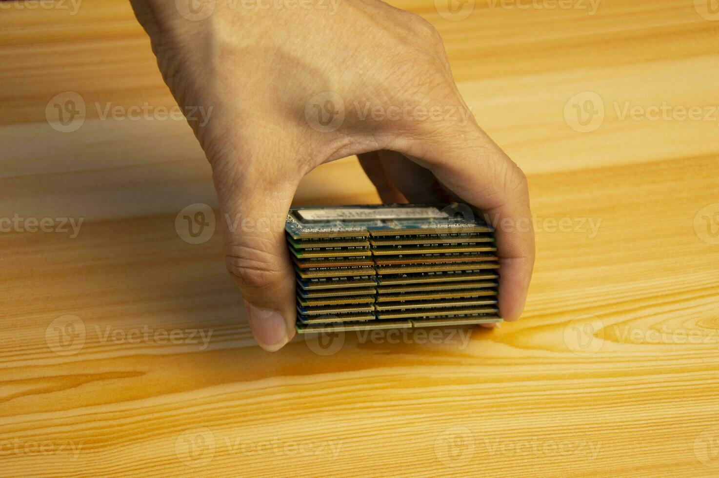 Many stacked laptop ram in hand,RAM is a hardware device. computer key photo