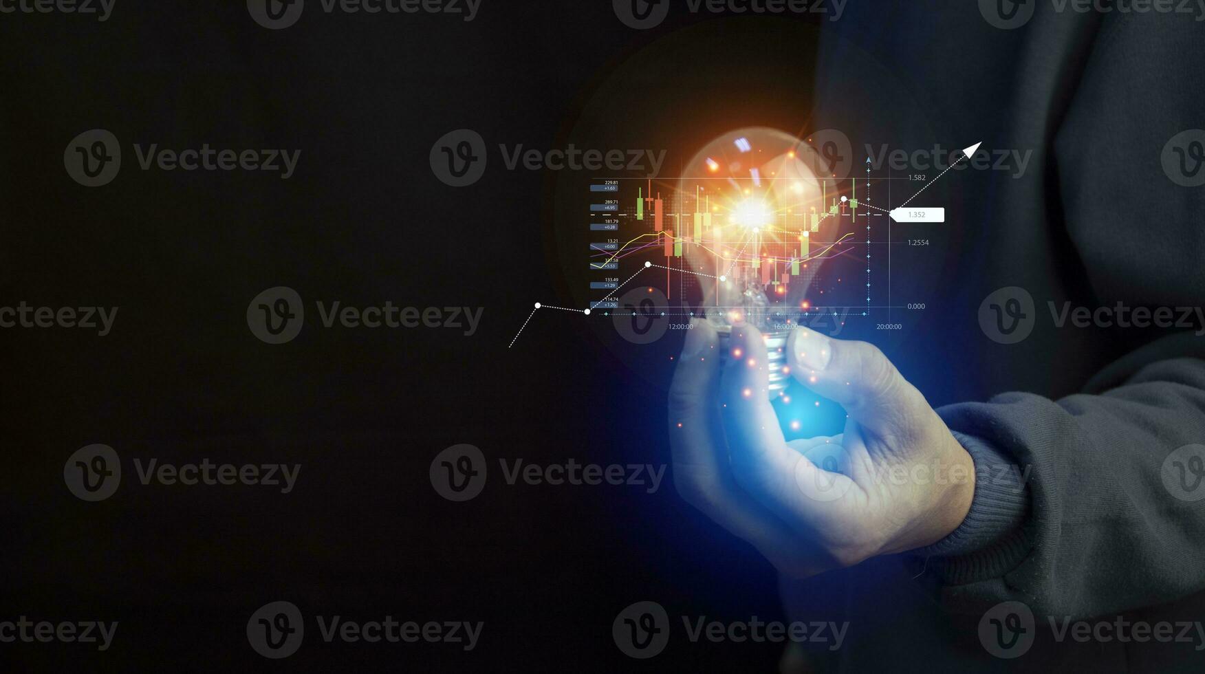 Close up of the hand of a person holding a bright light bulb in black background. Idea, innovation, idea and inspiration for business concept. cyber digital data concept photo