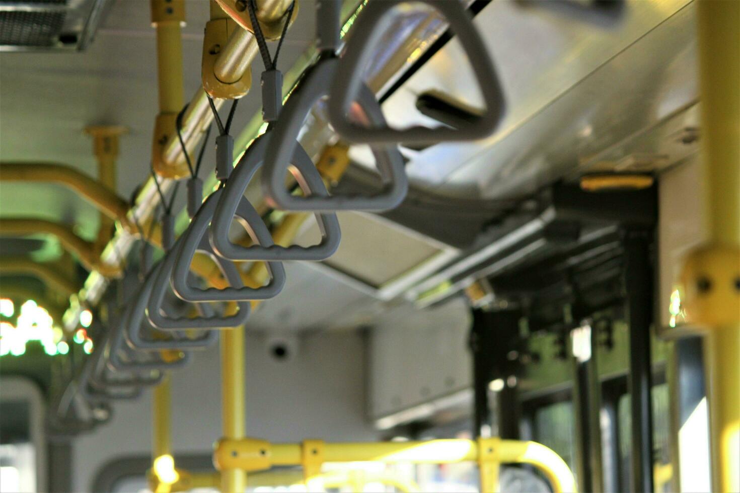 jakarta, indonesia-18 june 2023 transjakarta bus handles with the theme of transjakarta bus interiors photo