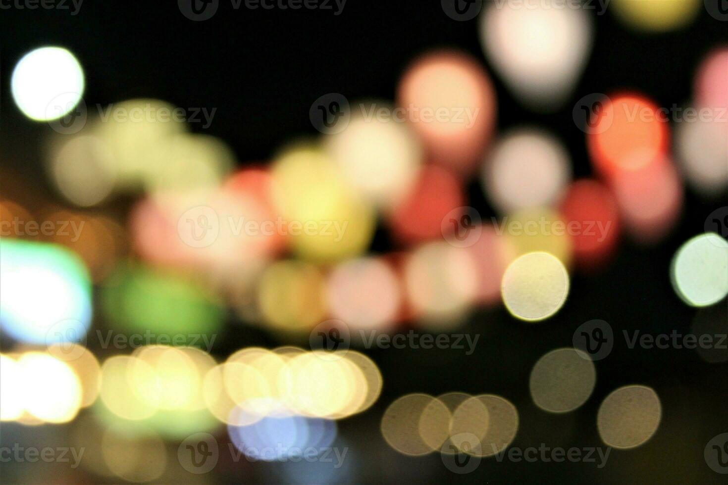 Blur background of sparkling lights with dark background photo
