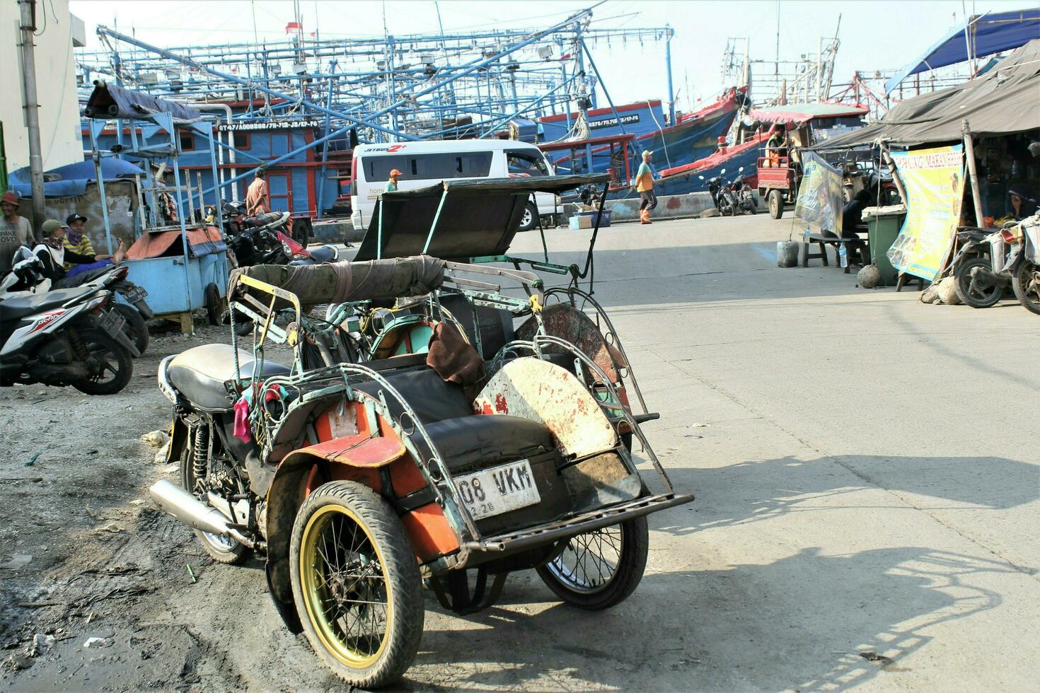 Jakarta, Indonesia-18 June 2023 motorized rickshaw the result of a modification between a rickshaw and a motorbike photo