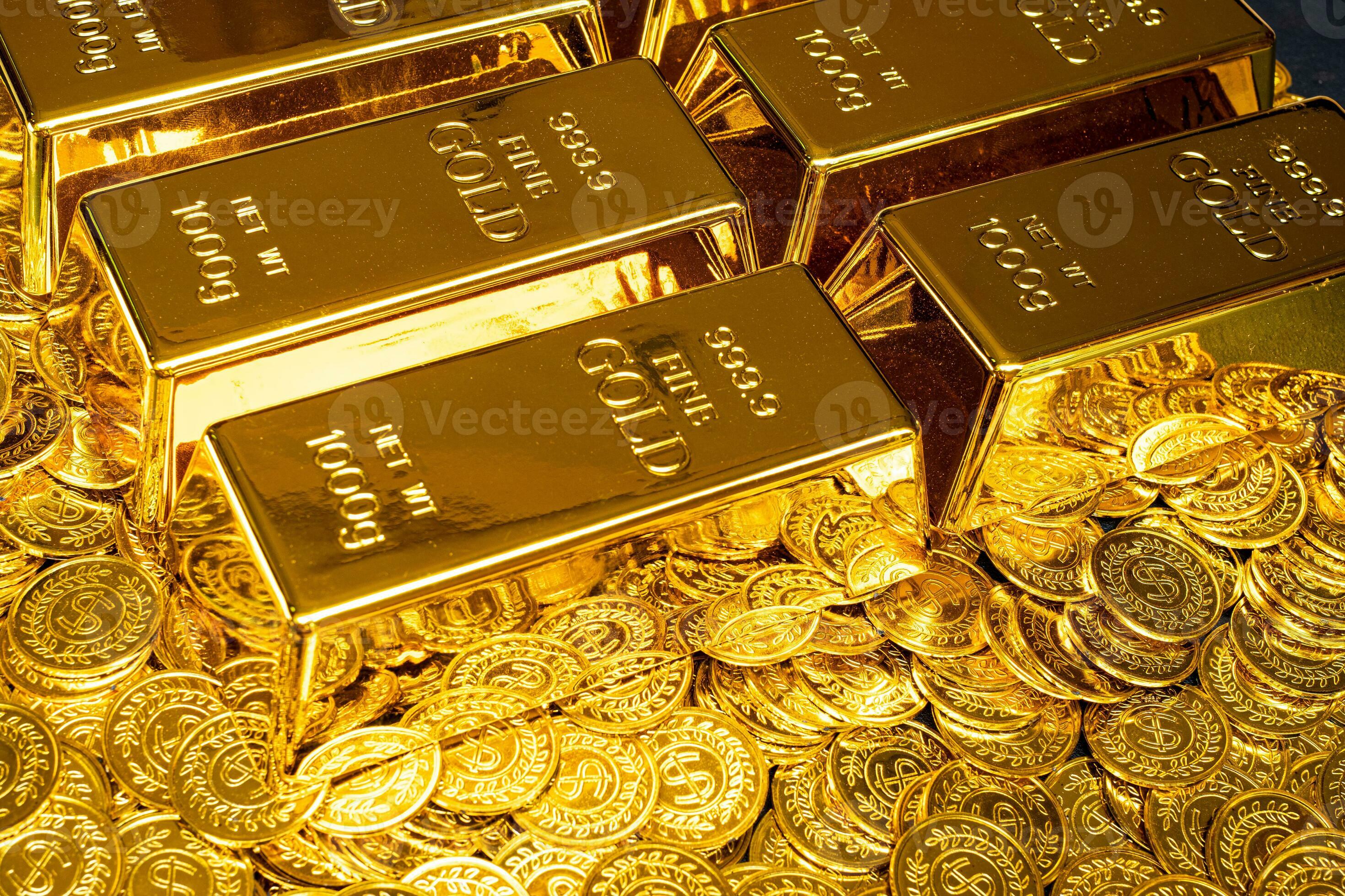 Gold bars are placed on a pile of gold coins 26334430 Stock Photo at