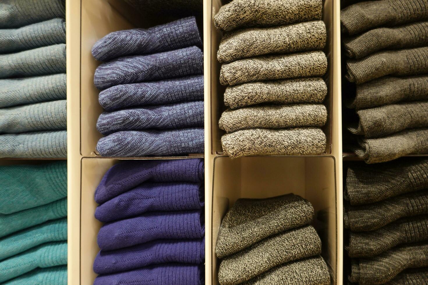 Colorful socks on shelf in a shopping mall. photo