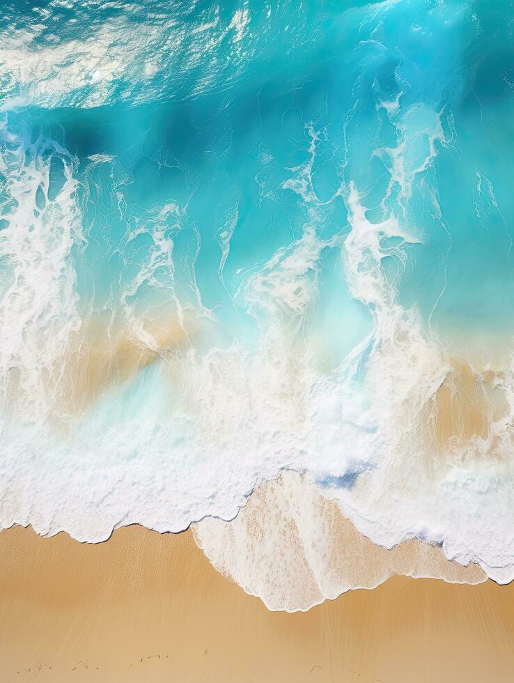 Drone shot of a tropical sea with waves crashing on the sand photo