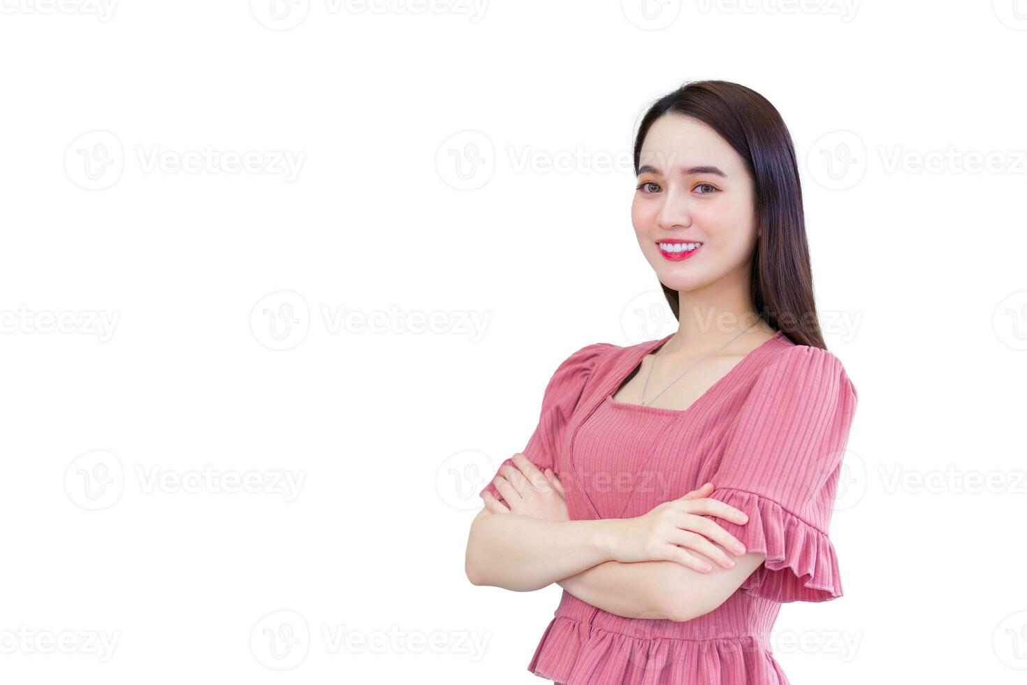 Professional young Asian business successful female who wears pink is arm crossing confidence and smiling happily in office while isolated on white background. photo