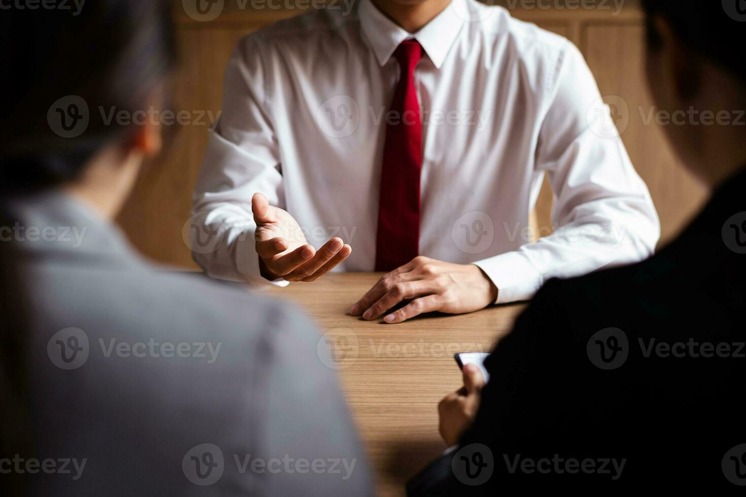 Image of employer or recruiter holding reading a resume during about colloquy his profile of candidate. photo