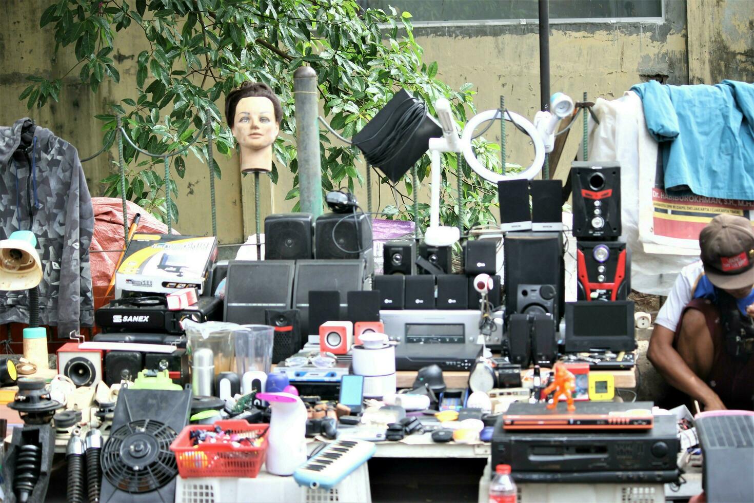 Jakarta, Indonesia-18 June 2023 used goods dealer on the side of the city road photo